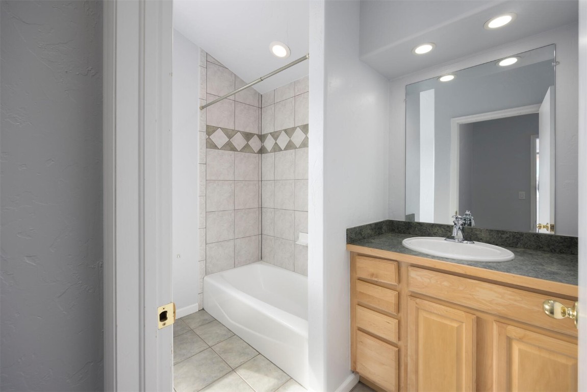 231 Alpine Road Dillon, CO 80435 - Photo 29 of 40 a bathroom with a granite countertop sink a mirror and a bathtub