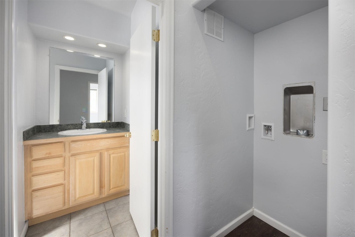 231 Alpine Road Dillon, CO 80435 - Photo 30 of 40 a bathroom with a sink and a mirror