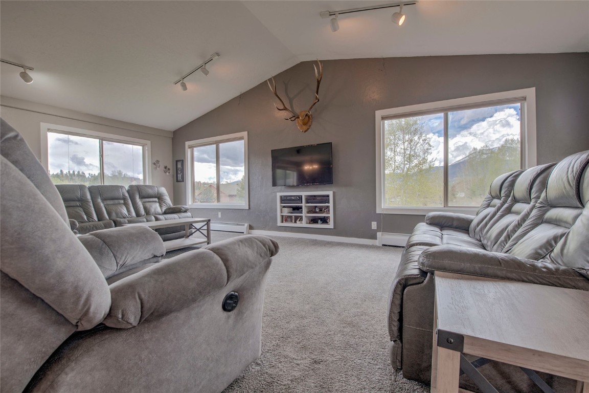 231 Alpine Road Dillon, CO 80435 - Photo 3 of 40 a living room with furniture and a flat screen tv