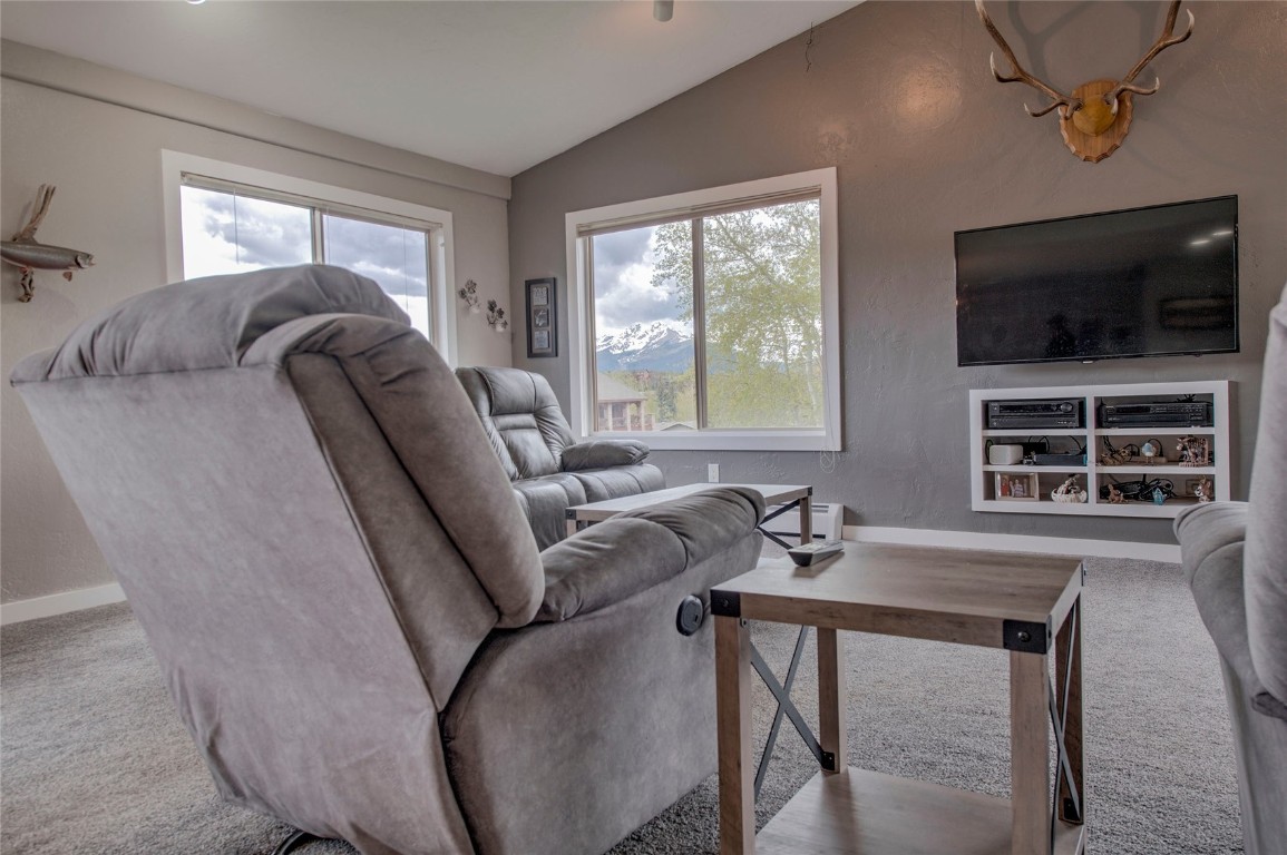 231 Alpine Road Dillon, CO 80435 - Photo 4 of 40 a living room with furniture and a flat screen tv