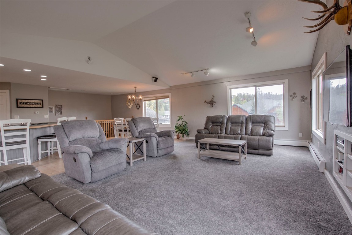 231 Alpine Road Dillon, CO 80435 - Photo 5 of 40 a living room with furniture and a chandelier