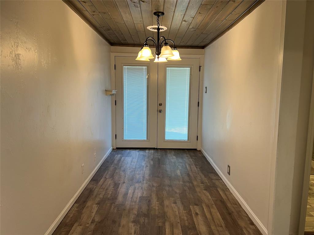 533 East Sears Street Denison, TX 75021 - Photo 11 of 27 a view of an empty room with glass door
