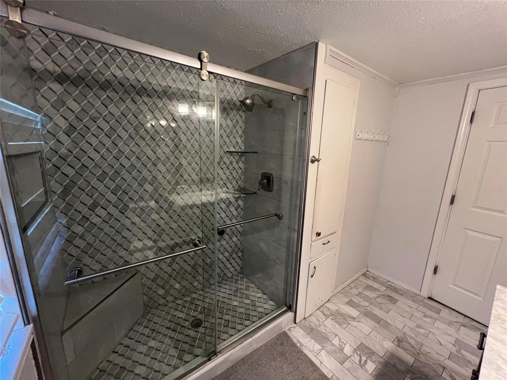 533 East Sears Street Denison, TX 75021 - Photo 18 of 27 a bathroom with a shower