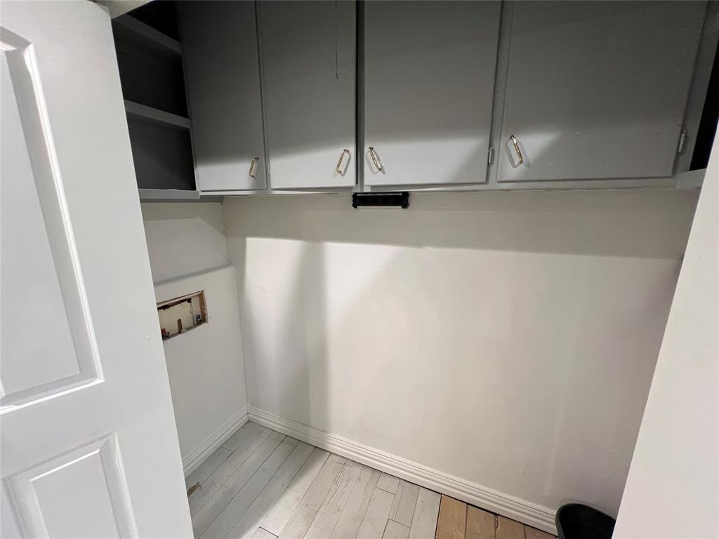 533 East Sears Street Denison, TX 75021 - Photo 21 of 27 a view of walk in closet with empty racks