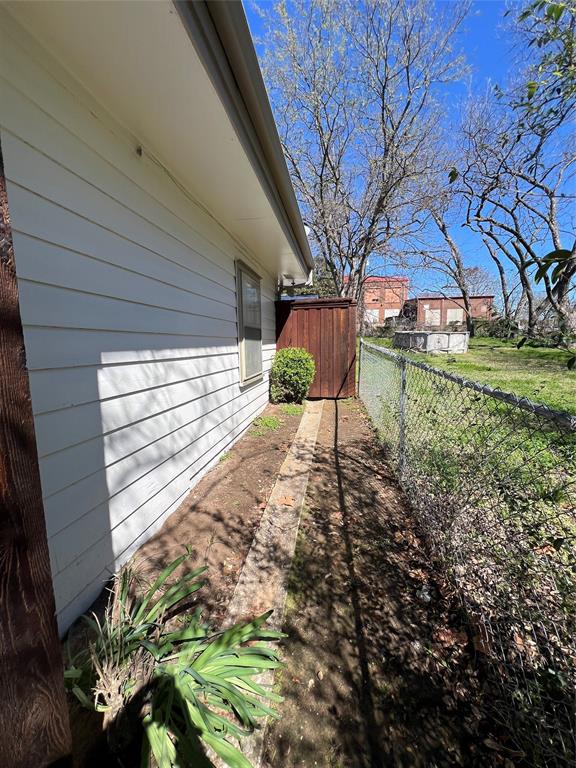 533 East Sears Street Denison, TX 75021 - Photo 22 of 27 a backyard of a house with lots of green space