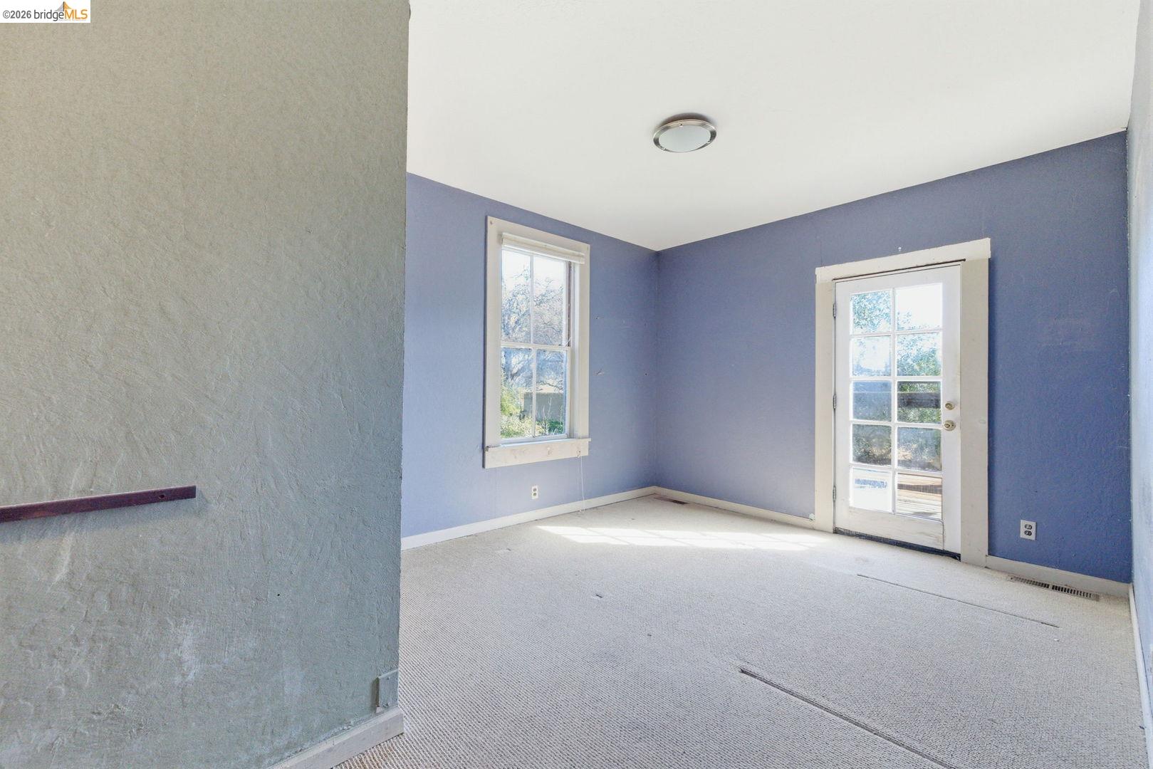 16129 Jacksonville Road Jamestown, CA 95327 - Photo 12 of 39 an empty room with windows