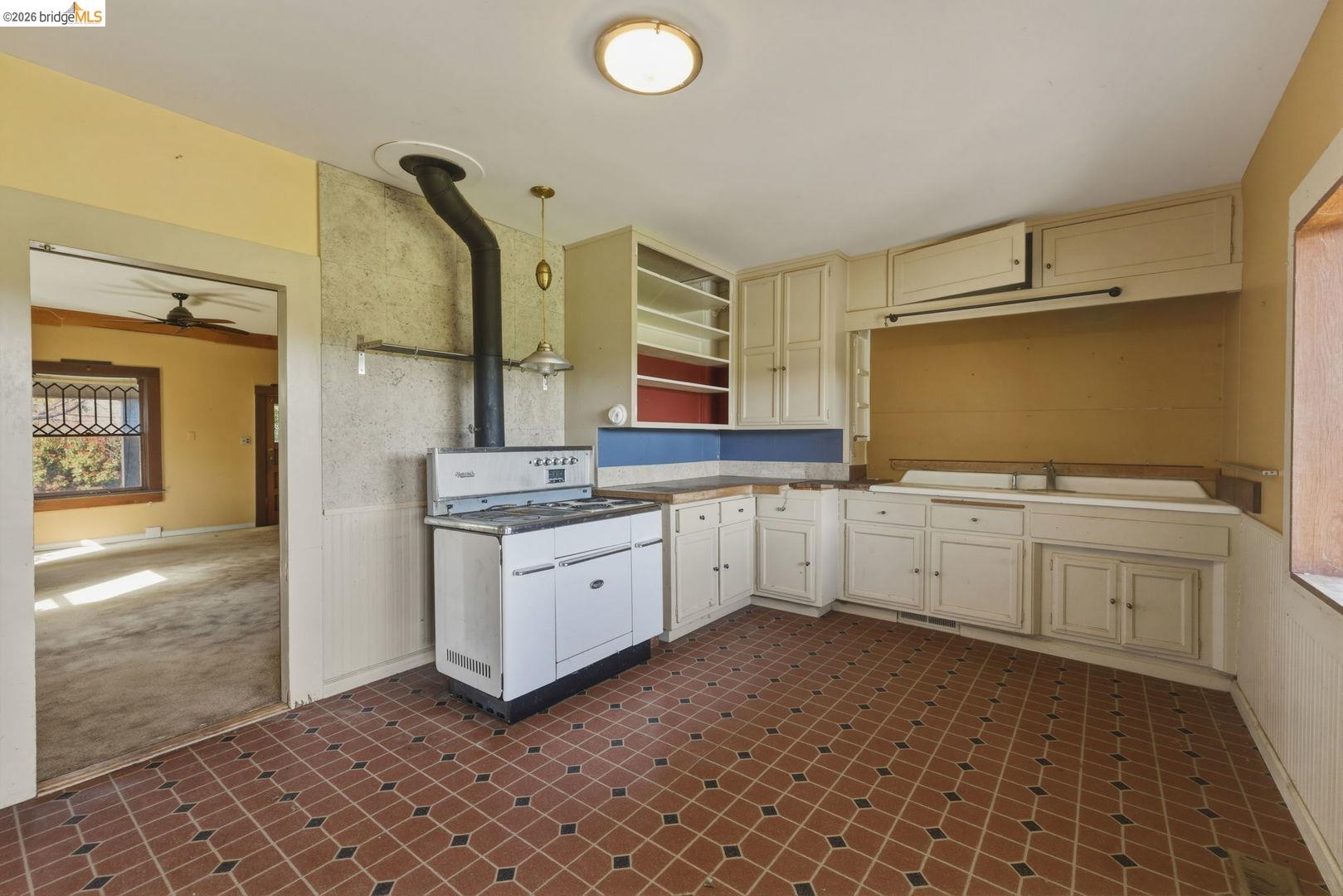 16129 Jacksonville Road Jamestown, CA 95327 - Photo 16 of 39 a kitchen with granite countertop a sink and a stove