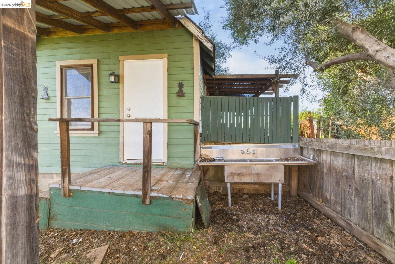 16129 Jacksonville Road Jamestown, CA 95327 - Photo 28 of 39 a backyard of a house with barbeque oven table and chairs
