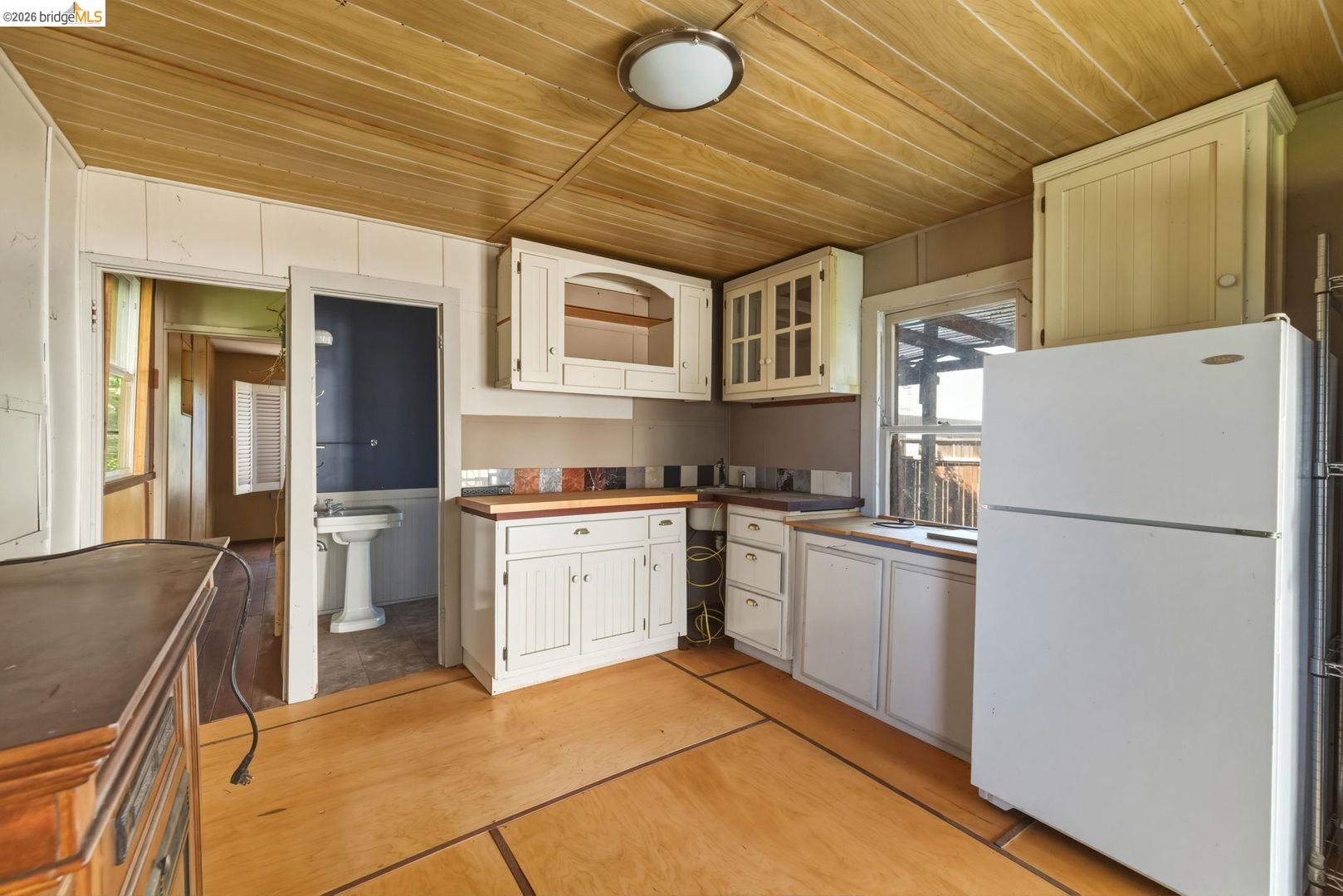 16129 Jacksonville Road Jamestown, CA 95327 - Photo 32 of 39 a kitchen with a refrigerator and a sink