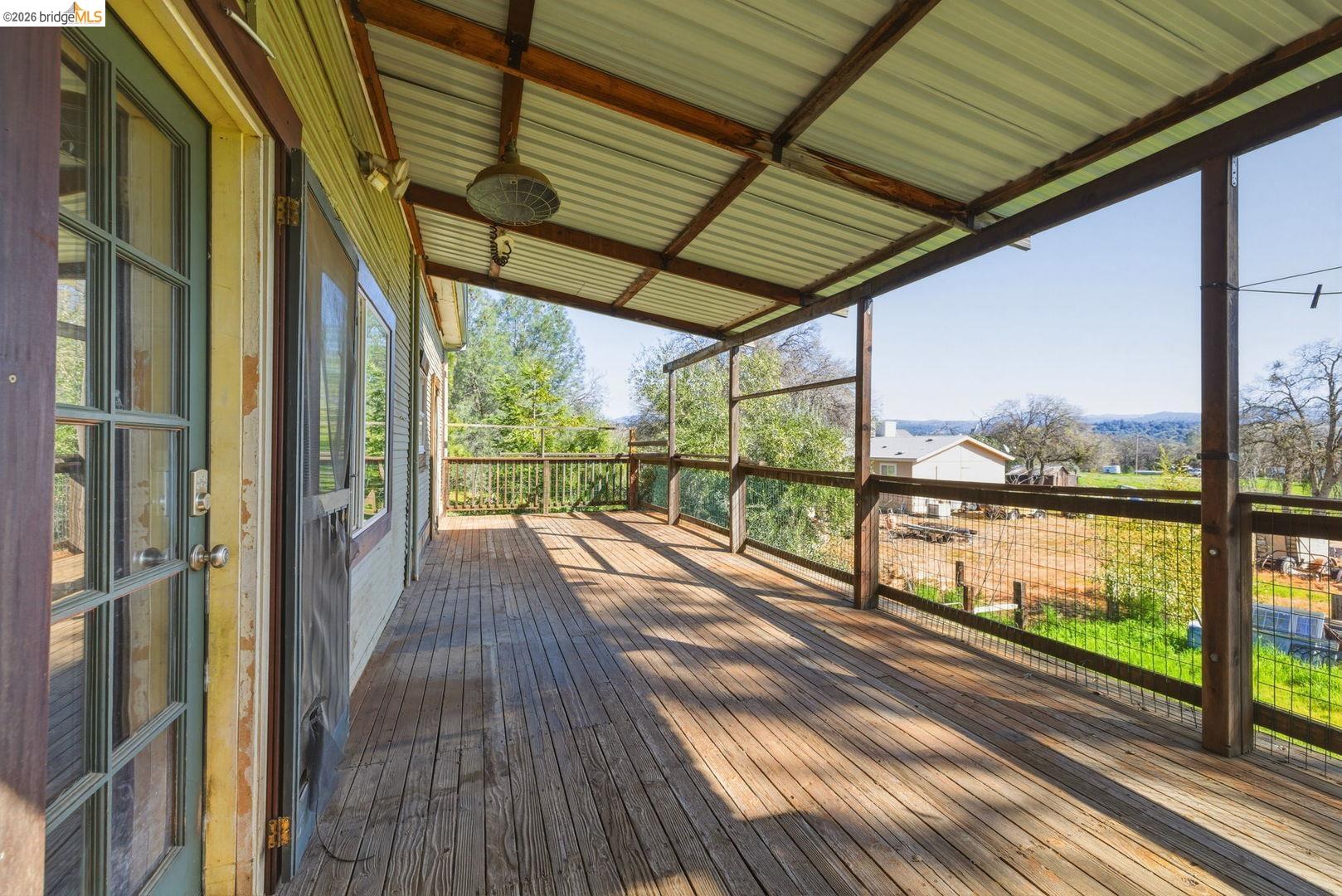 16129 Jacksonville Road Jamestown, CA 95327 - Photo 35 of 39 a view of a balcony with wooden floor