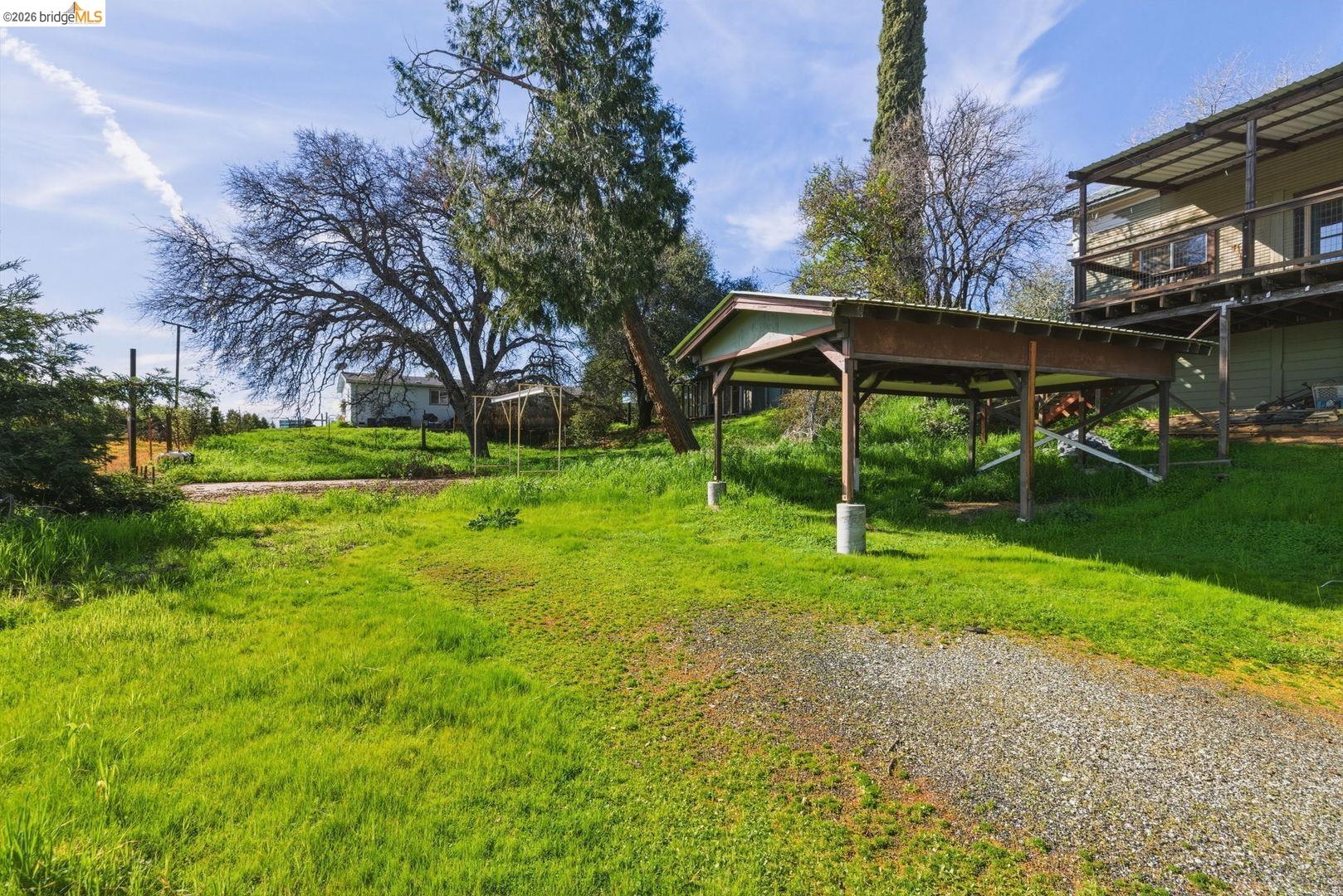 16129 Jacksonville Road Jamestown, CA 95327 - Photo 37 of 39 a view of a house with backyard and sitting area
