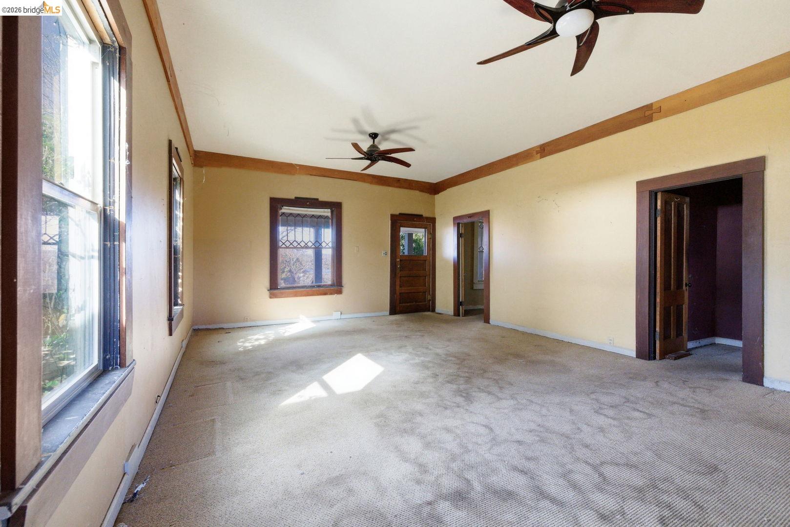 16129 Jacksonville Road Jamestown, CA 95327 - Photo 6 of 39 a view of a big room with windows and chandelier fan