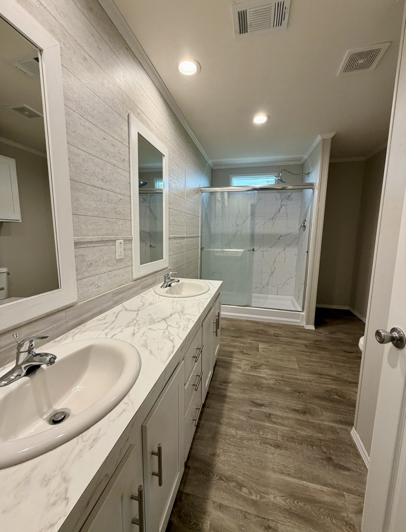 126 Castellana Way Elgin, TX 78621 - Photo 11 of 19 a bathroom with a sink and a mirror