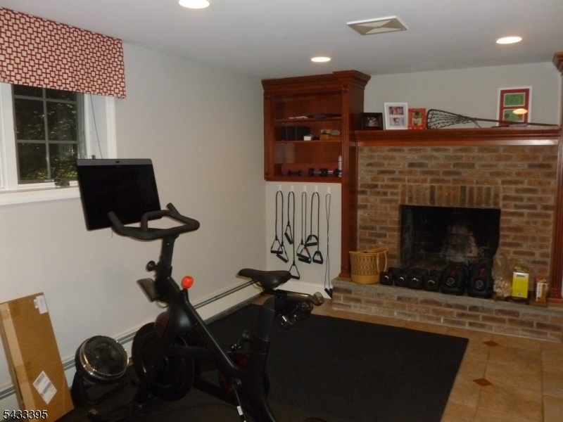 48 Woodmont Road Montclair, NJ 07043 - Photo 15 of 20 a living room with furniture and a fireplace