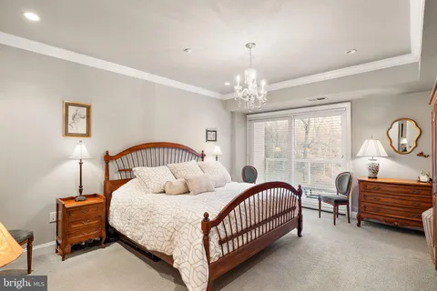 a bedroom with bed and a window