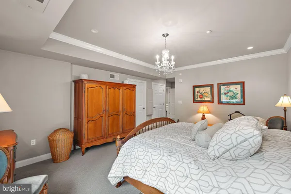 a bedroom with bed and window