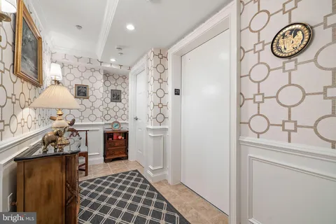 a living room with furniture a rug and a fireplace