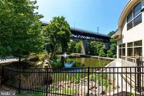 a view of balcony with wooden floor and fence