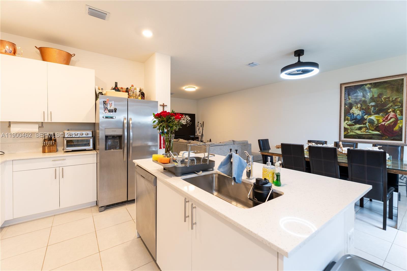 13132 Southwest 234th Terrace Homestead, FL 33032 - Photo 13 of 24 a kitchen with a white cabinets and white appliances