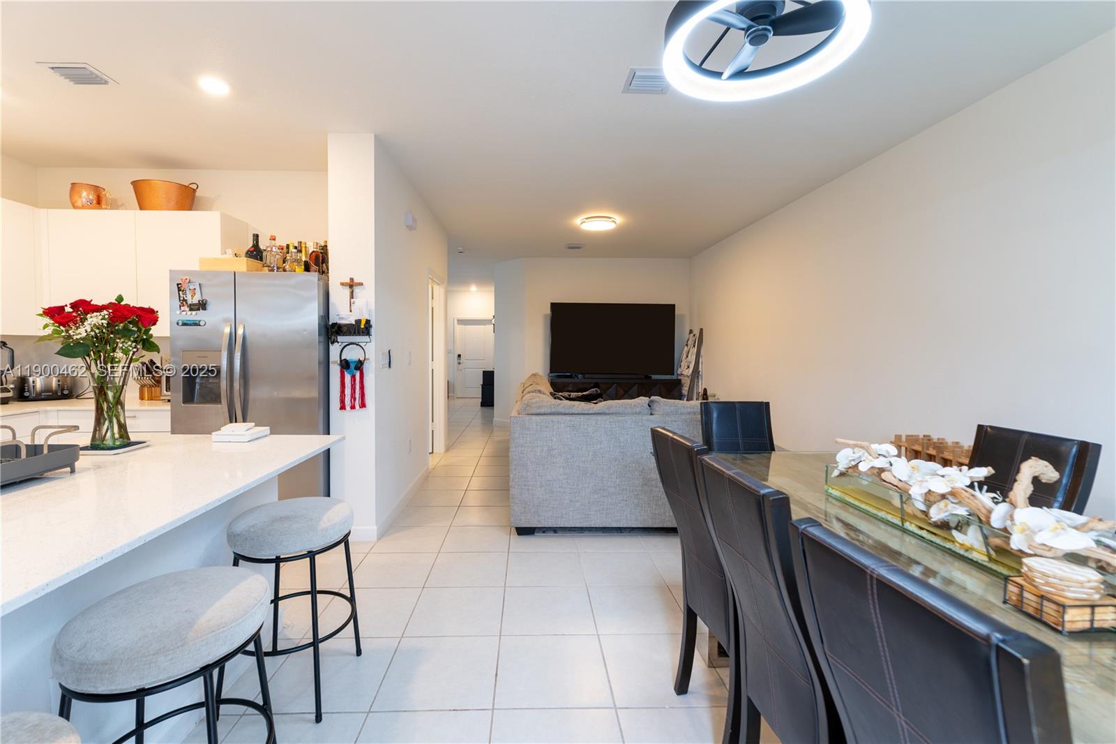 13132 Southwest 234th Terrace Homestead, FL 33032 - Photo 15 of 24 a dining room with furniture and a flat screen tv