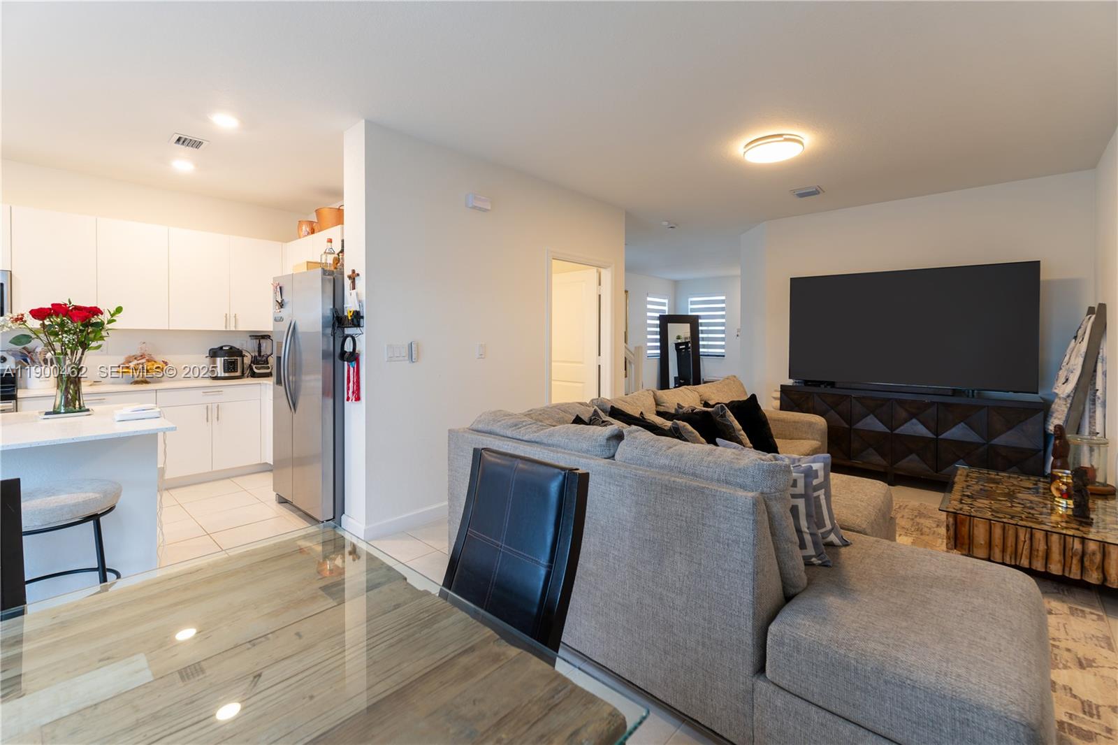 13132 Southwest 234th Terrace Homestead, FL 33032 - Photo 16 of 24 a living room with furniture and a flat screen tv