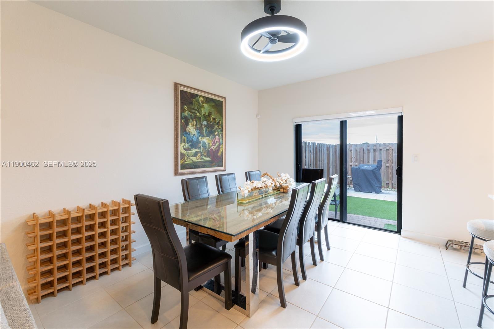 13132 Southwest 234th Terrace Homestead, FL 33032 - Photo 17 of 24 a view of a dining room with furniture window and outside view