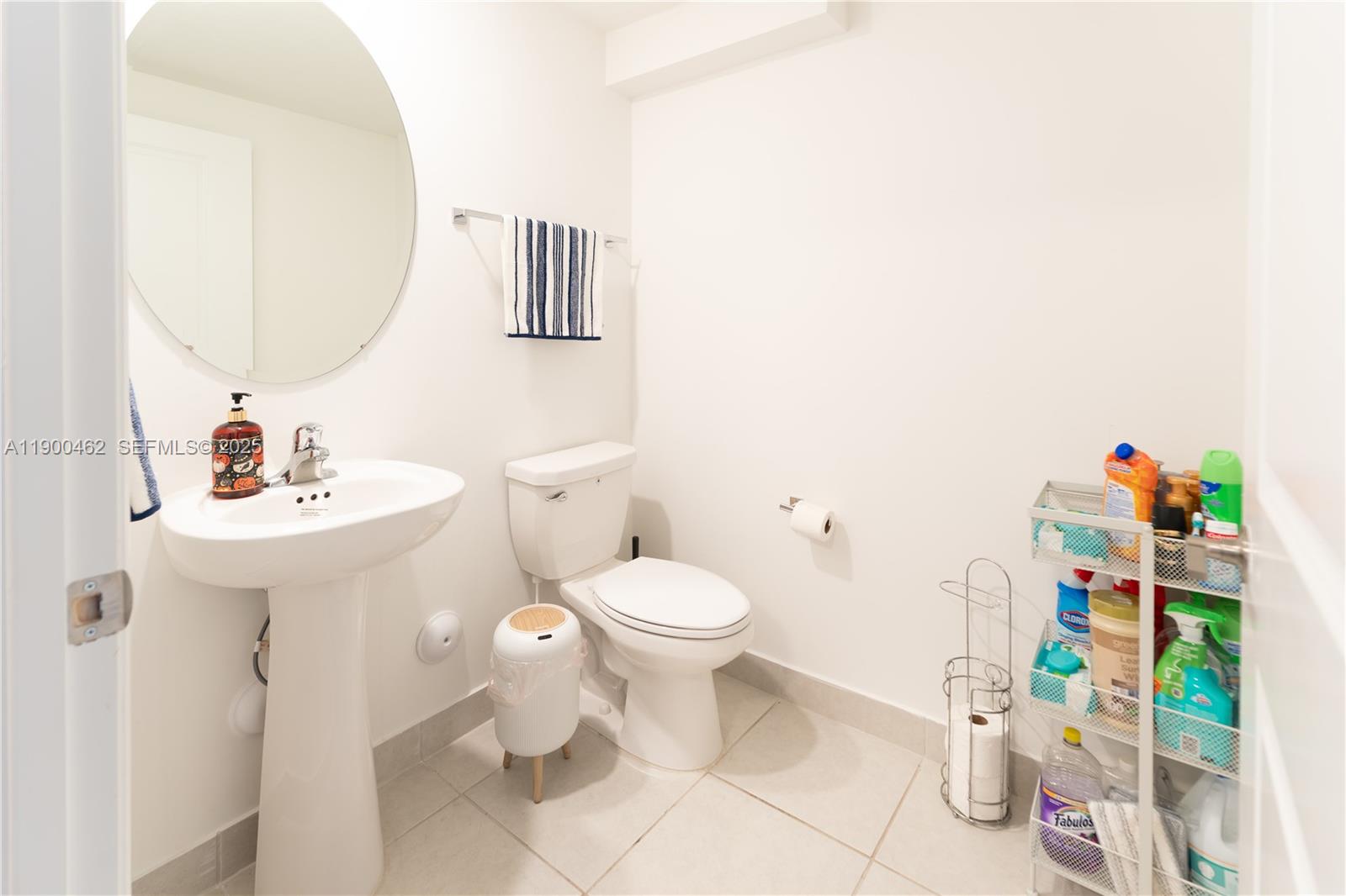 13132 Southwest 234th Terrace Homestead, FL 33032 - Photo 18 of 24 a bathroom with a sink toilet and mirror