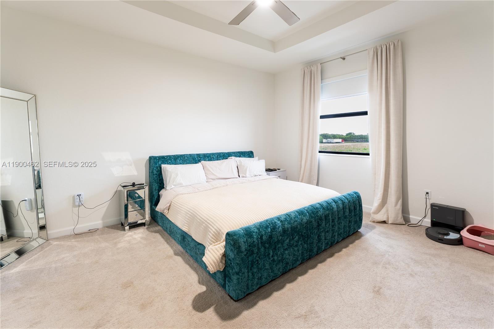 13132 Southwest 234th Terrace Homestead, FL 33032 - Photo 19 of 24 a bedroom with a bed and a window