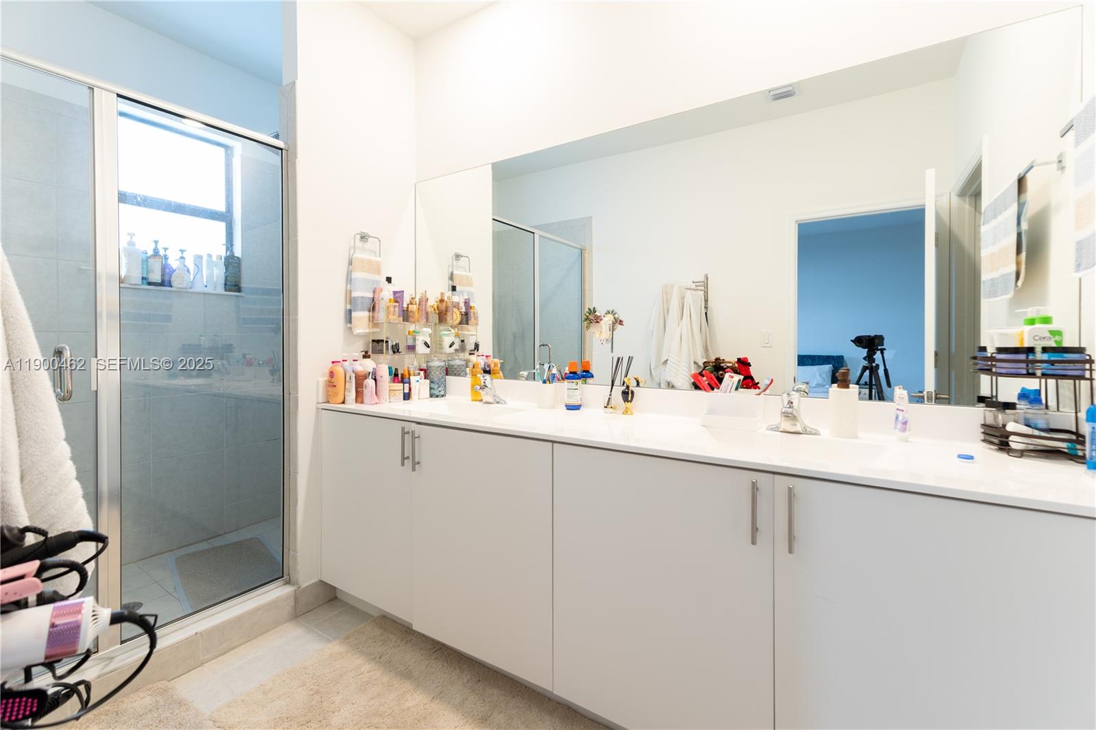 13132 Southwest 234th Terrace Homestead, FL 33032 - Photo 20 of 24 a bathroom with a sink and a mirror