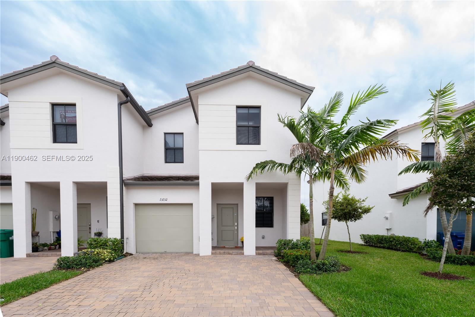 13132 Southwest 234th Terrace Homestead, FL 33032 - Photo 24 of 24 a front view of a house with a garden and plants