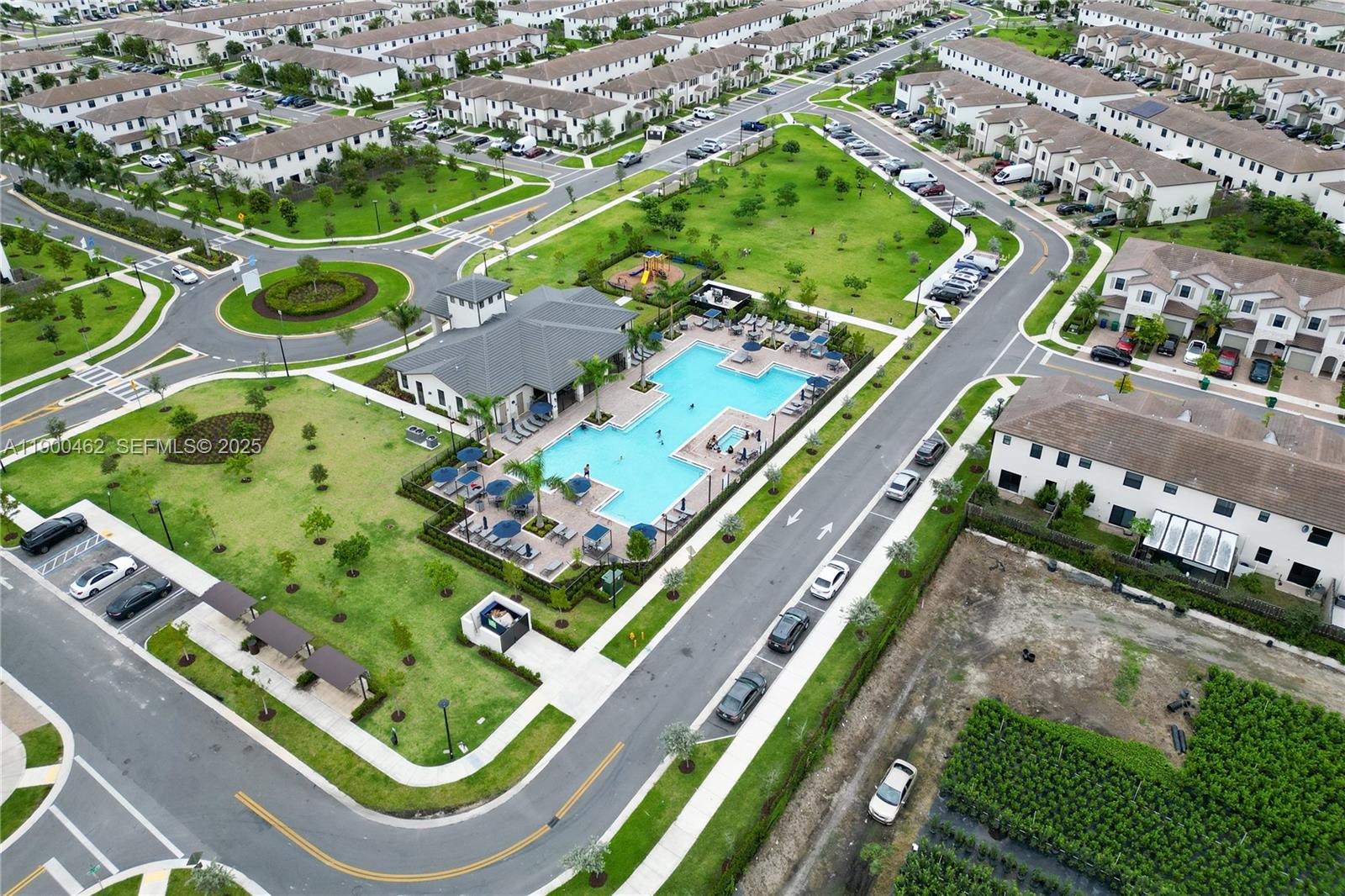 13132 Southwest 234th Terrace Homestead, FL 33032 - Photo 7 of 24 an aerial view of a tennis ground and a cars park