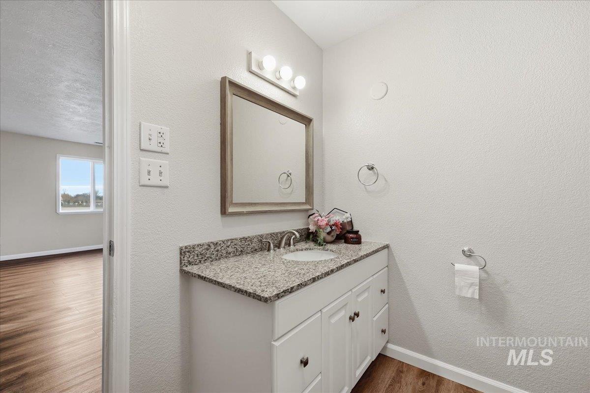 14666 Willis Road Caldwell, ID 83607 - Photo 13 of 23 Primary Bathroom. single vanity with granite counter