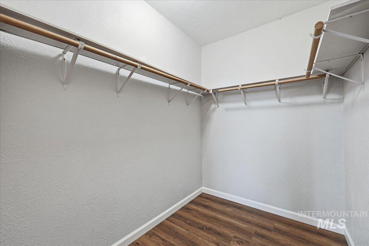14666 Willis Road Caldwell, ID 83607 - Photo 9 of 20 Spacious closet featuring dark wood-style floors