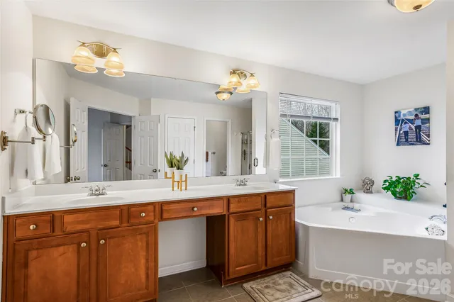 a bathroom with a sink double vanity and a mirror