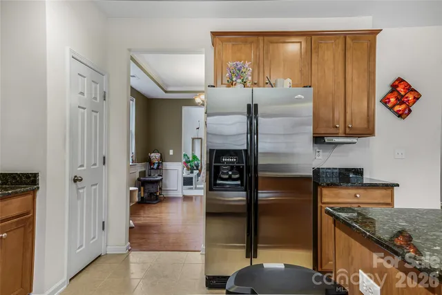 a kitchen with refrigerator and window
