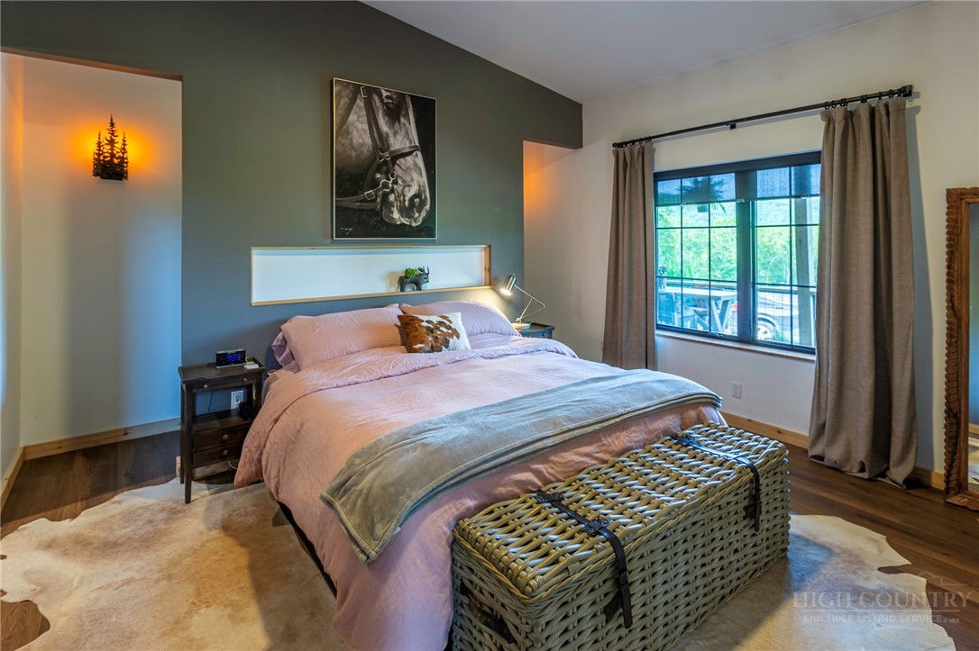 509 Grant Houck Road Todd, NC 28684 - Photo 29 of 43 a bedroom with a bed and a window