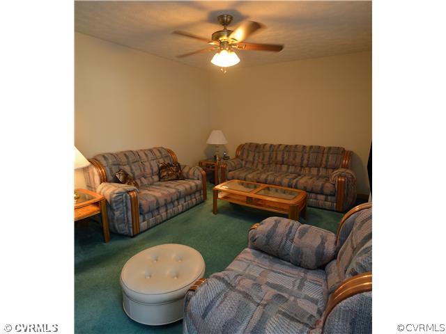 15713 Saddlebrook Road Chesterfield, VA 23838 - Photo 4 of 19 a living room with furniture and a mirror