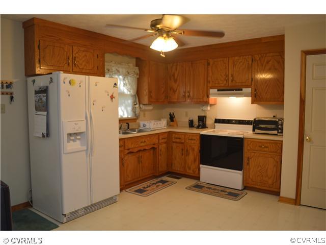 15713 Saddlebrook Road Chesterfield, VA 23838 - Photo 7 of 19 a kitchen with cabinets and stainless steel appliances