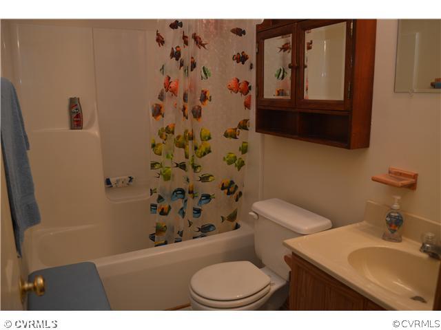 15713 Saddlebrook Road Chesterfield, VA 23838 - Photo 10 of 19 a bathroom with a toilet sink and mirror