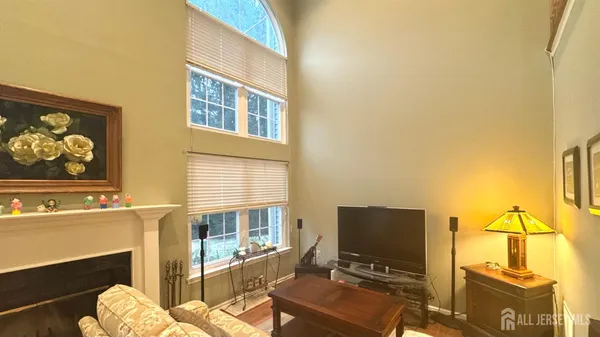 a bedroom with a bed and a tv