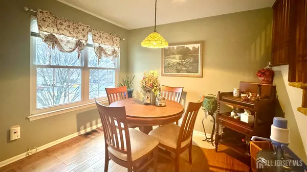 a living room with furniture and next to a window