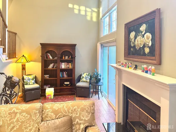 a living room with a fireplace and a window