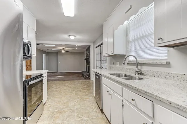 a kitchen with a sink and cabinets