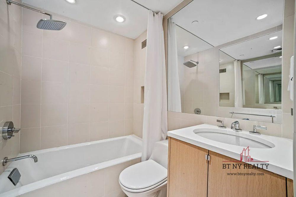 160 Central Park South, Unit 2118/2120 Manhattan, NY 10019 - Photo 6 of 16 a bathroom with a sink a toilet and a bathtub
