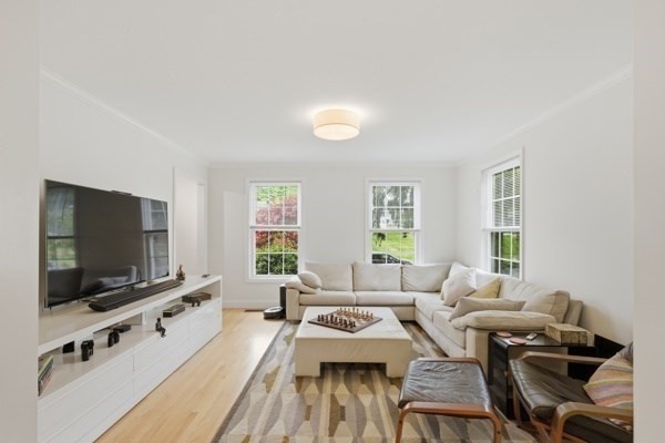 3 Wing Road Wilmington, MA 01887 - Photo 14 of 36 a living room with furniture and a flat screen tv