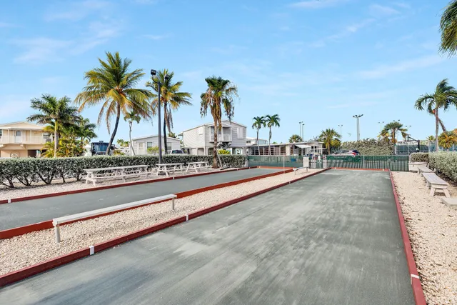 a view of a chairs and table in the patio