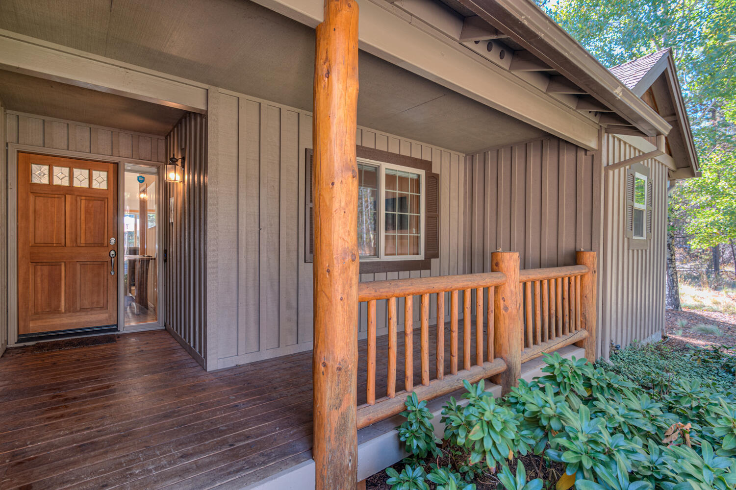 17295 Azusa Road Bend, OR 97707 - Photo 3 of 40 a view of a house with porch and wooden floor