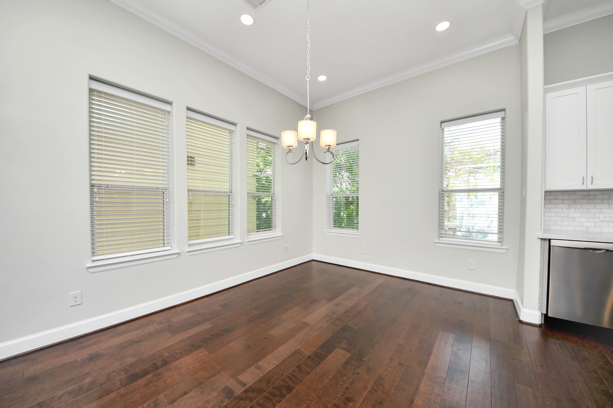 1716 Stuart Street Houston, TX 77004 - Photo 15 of 39 a view of an empty room with window and wooden floor