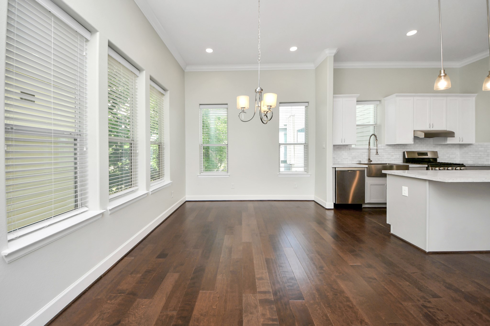 1716 Stuart Street Houston, TX 77004 - Photo 16 of 39 a view of kitchen with cabinets and wooden floor