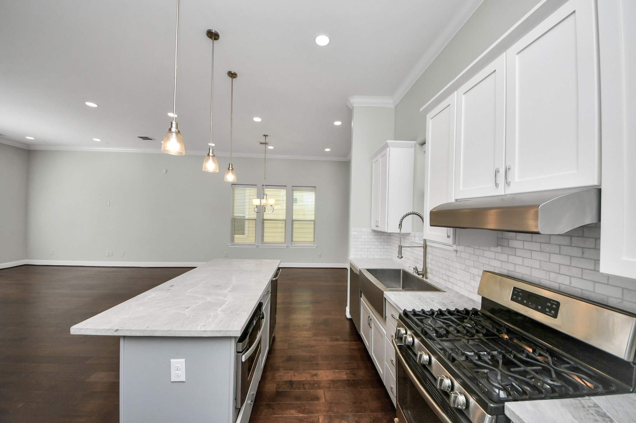1716 Stuart Street Houston, TX 77004 - Photo 18 of 39 a kitchen with stainless steel appliances granite countertop a stove a sink and a microwave